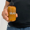 Vitaman Hair Food 250ml Bottle in hand